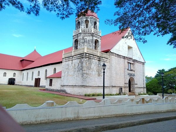 Lazi Church and Convent: Visit the historic Lazi Church and Convent, also known as San Isidro Labrador Parish Church, which is recognized as a UNESCO World Heritage Site. Marvel at the intricate Baroque architecture and learn about the rich cultural heritage of the area.