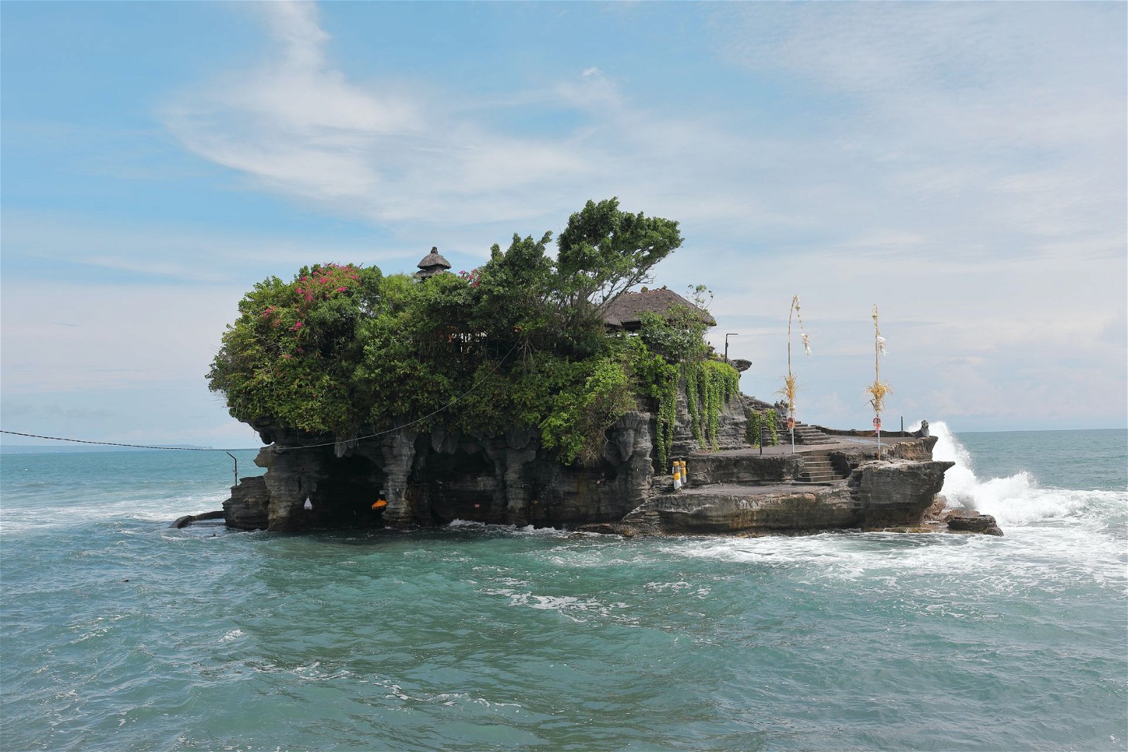 One of Bali's most iconic landmarks, Tanah Lot Temple is perched on a rocky outcrop surrounded by the Indian Ocean
