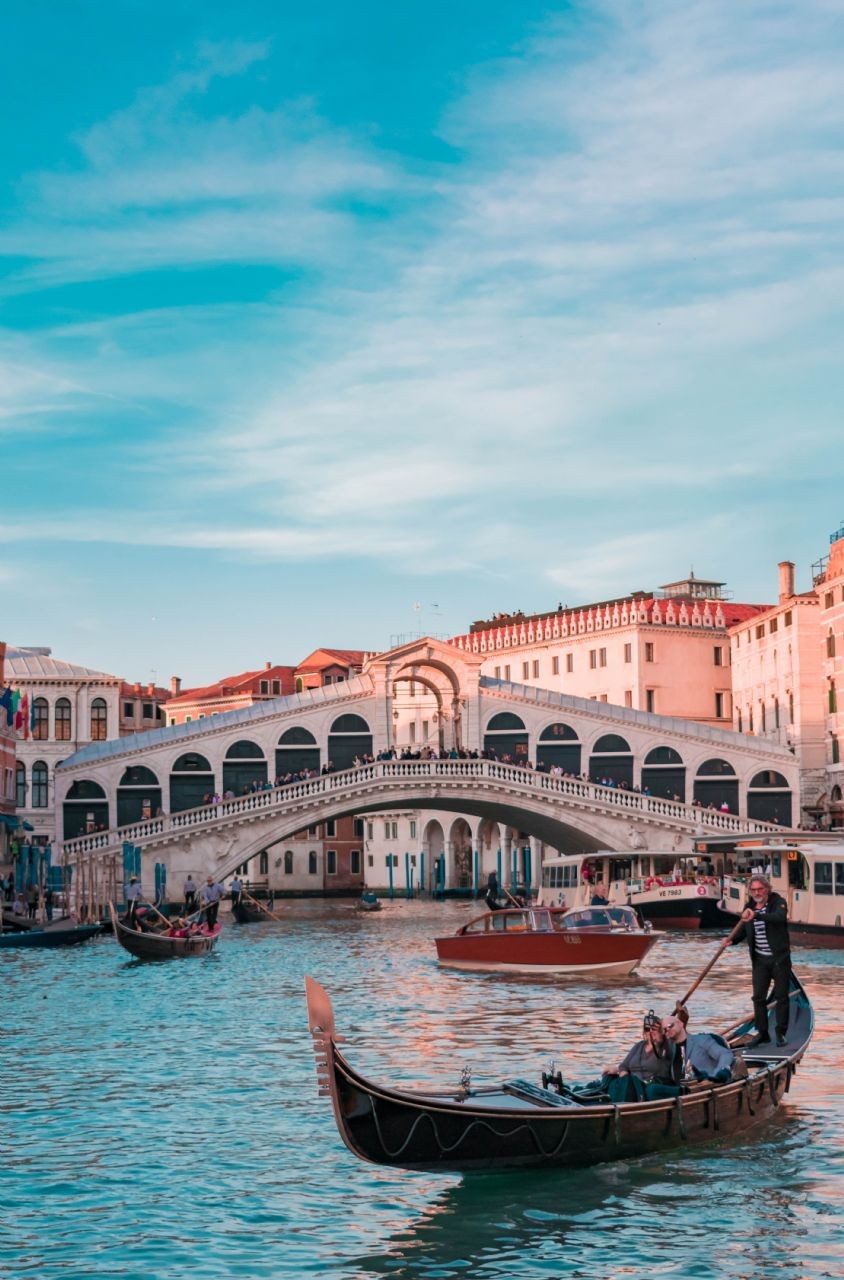 Rialto Bridge: The Rialto Bridge is one of the most famous bridges in Venice. It is the oldest bridge across the Grand Canal and offers stunning views of the cit
