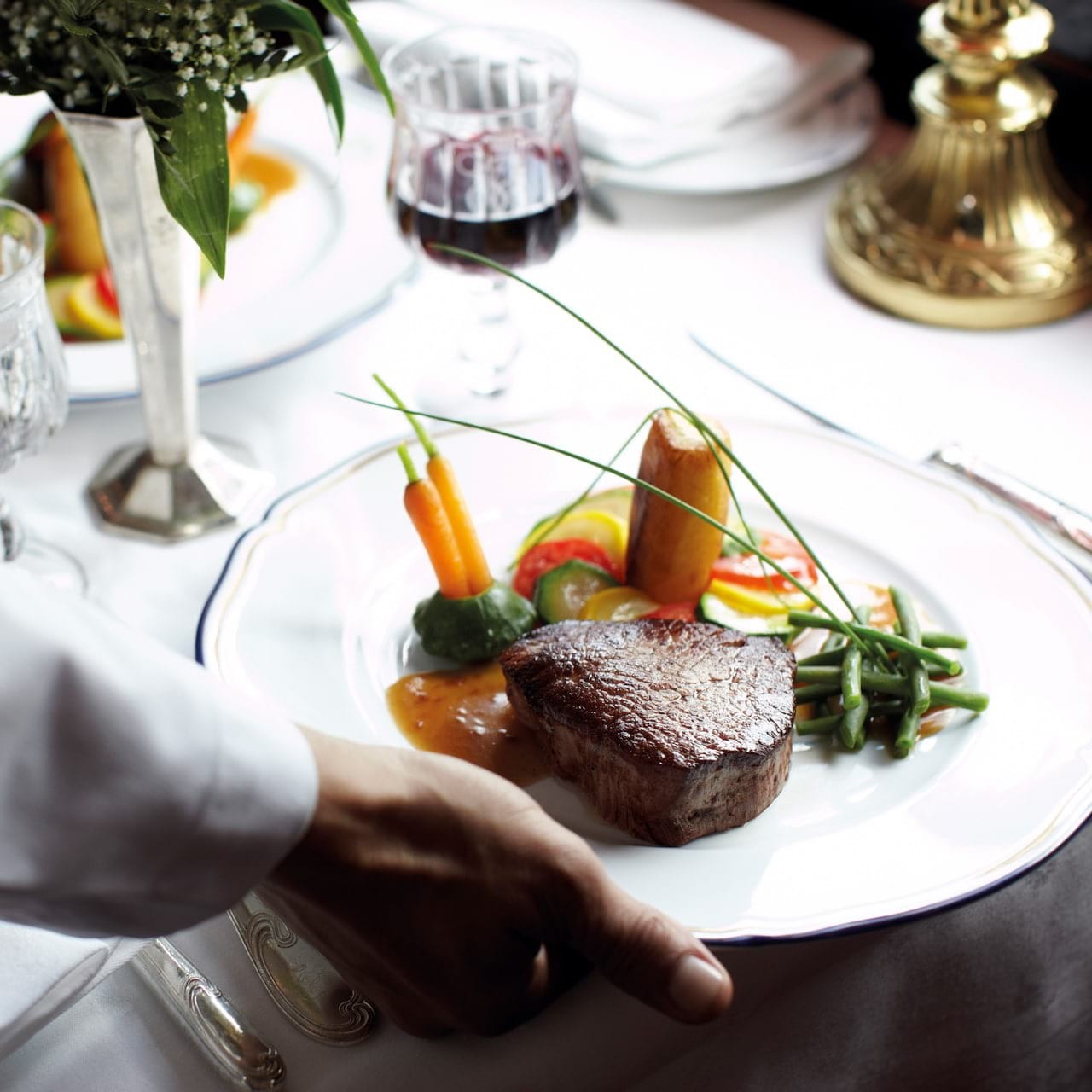 Dinner: The highlight of the culinary experience on the Venice Simplon-Orient-Express is the sumptuous dinner served in the elegant dining cars. The dinner is a multi-course affair, featuring gourmet creations that showcase the expertise of the onboard chefs.