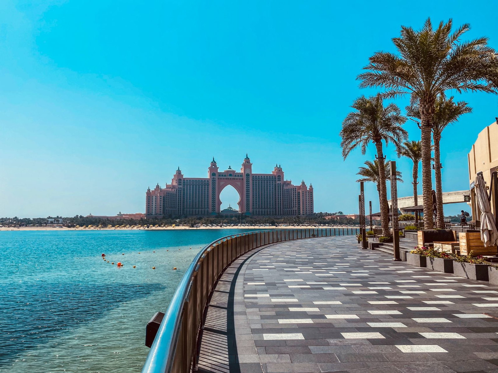 Drive to Palm Jumeirah, an artificial island shaped like a palm tree